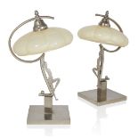 Art Deco Pair of figural table lamps, circa 1940 Chromed metal, moulded glass Each 37cm high It...