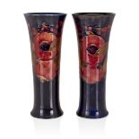 William Moorcroft (1872-1945) Near pair of pomegranate trumpet vases, 1916-18 Glazed earthenware...