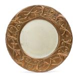 Arts and Crafts Circular mirror with intertwined vines decoration, circa 1900 Copper, mirrored g...