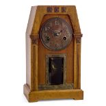 Glasgow School Arts and Crafts twin-train mantel clock carved with Glasgow roses, circa 1900 Oak...