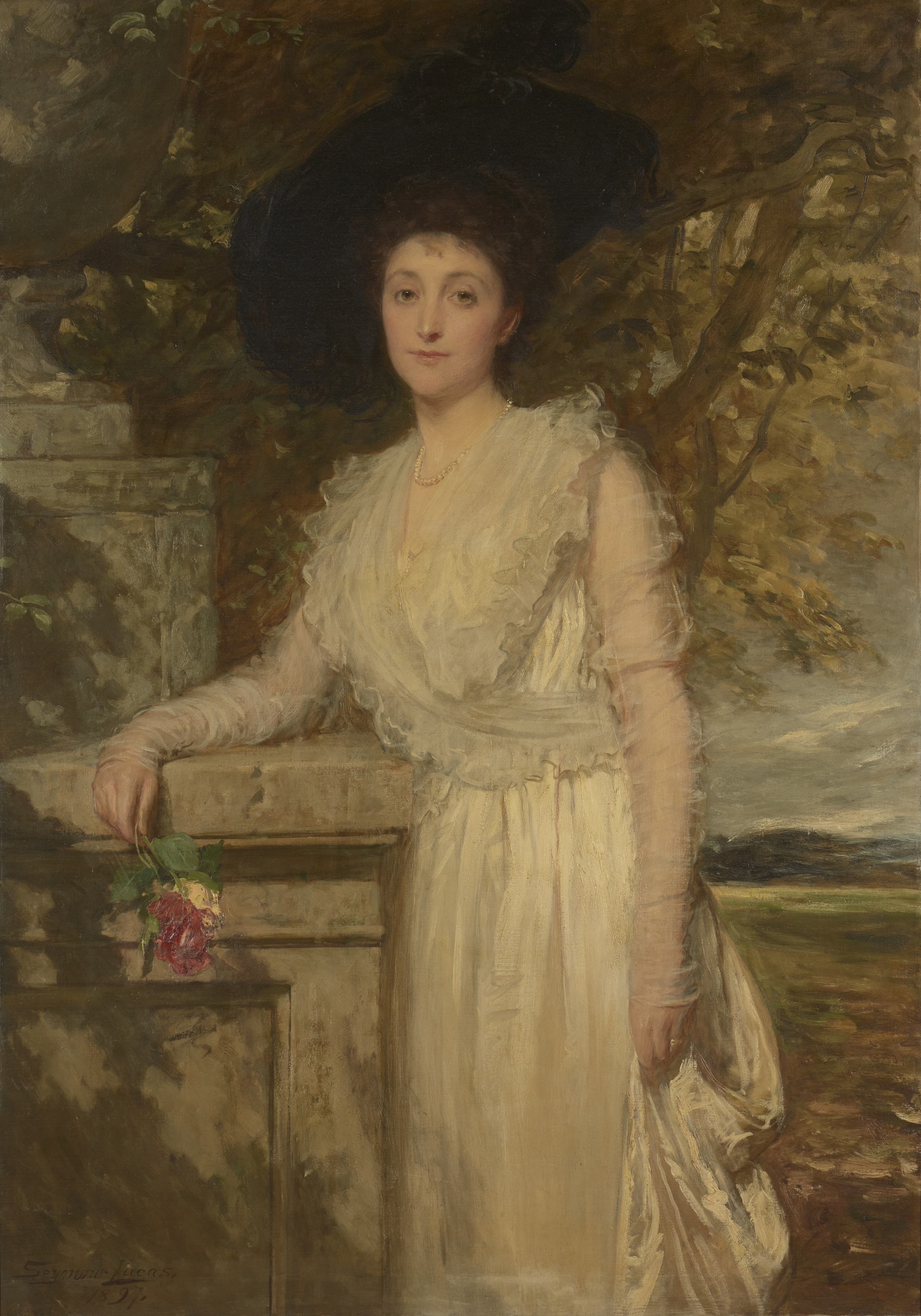 John Seymour Lucas, RA RI,  British 1849-1923-  Portrait of Mrs Arthur Tooth, standing three-qua...