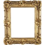 A Carved and Gilded Swept and Pierced Rococo Style Frame,  early 19th century-  with cavetto si...