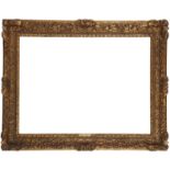 A Carved and Gilded Louis XIV Style Frame,  mid-late 19th century-  with schematic leaf sight, ...