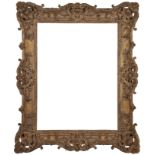 A French Carved and Gilded Swept and Pierced Louis XV Frame,  mid-late 18th century-  with cave...