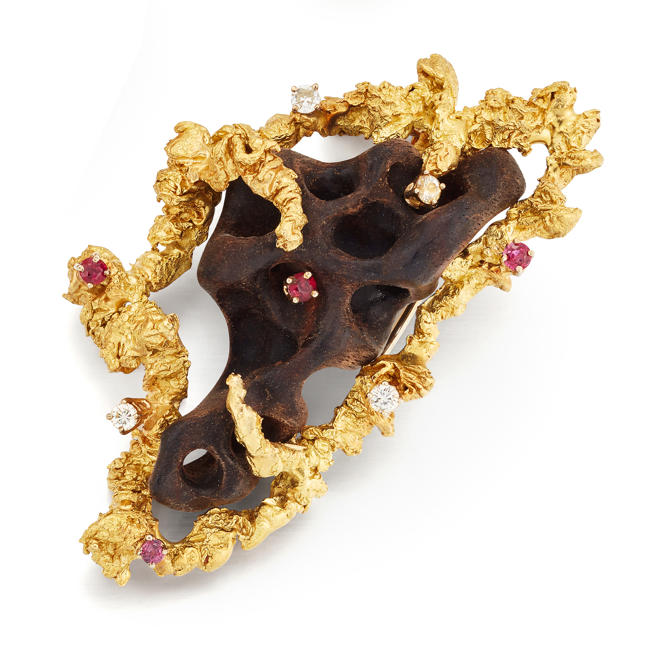 An ebony, diamond and ruby brooch,