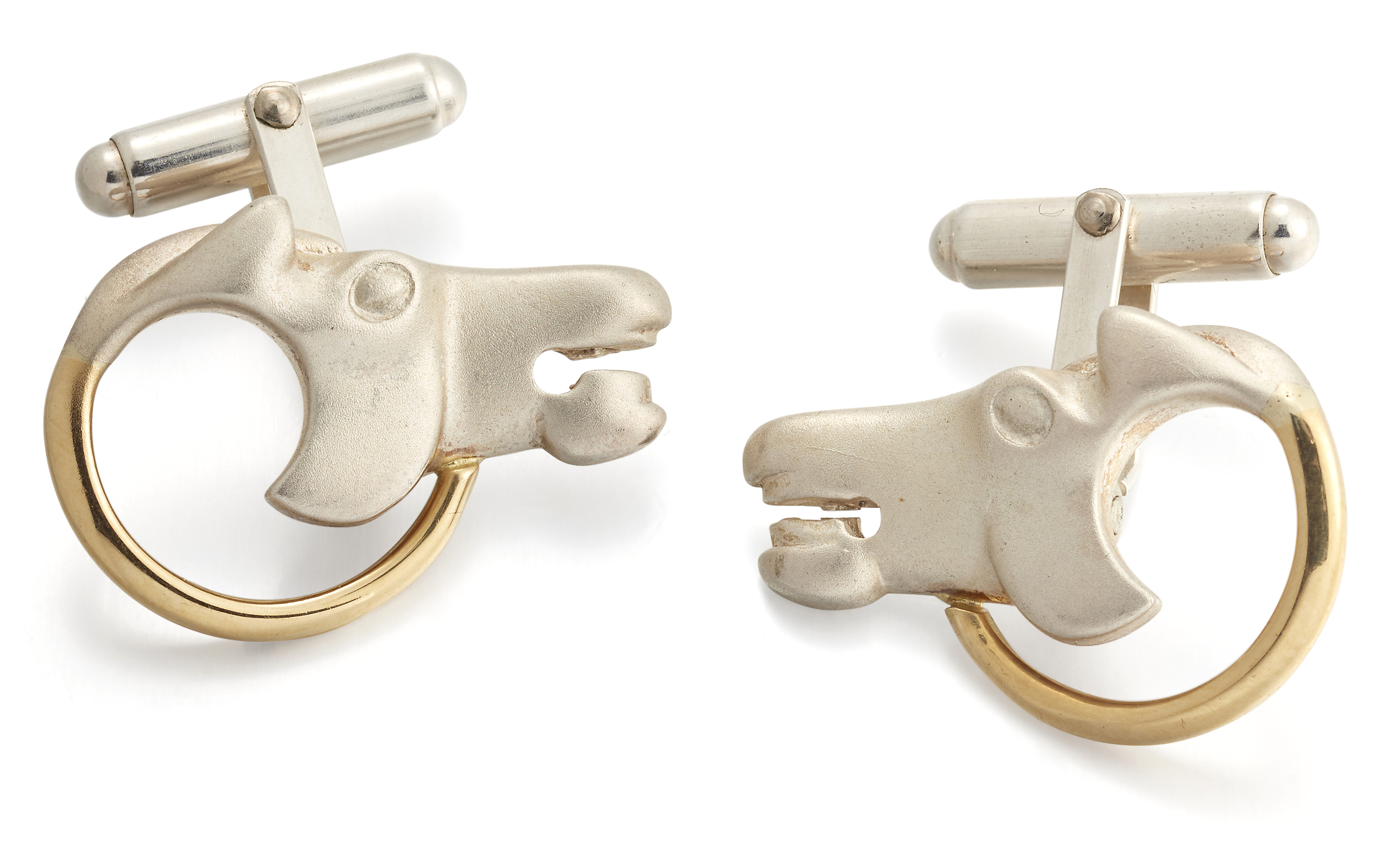 Brett Payne. A pair of 18ct gold and silver 'horse head' cufflinks,