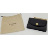 A Céline Paris black leather shoulder bag, c.1970s, gold hardware, with star ball logo inscribed ...