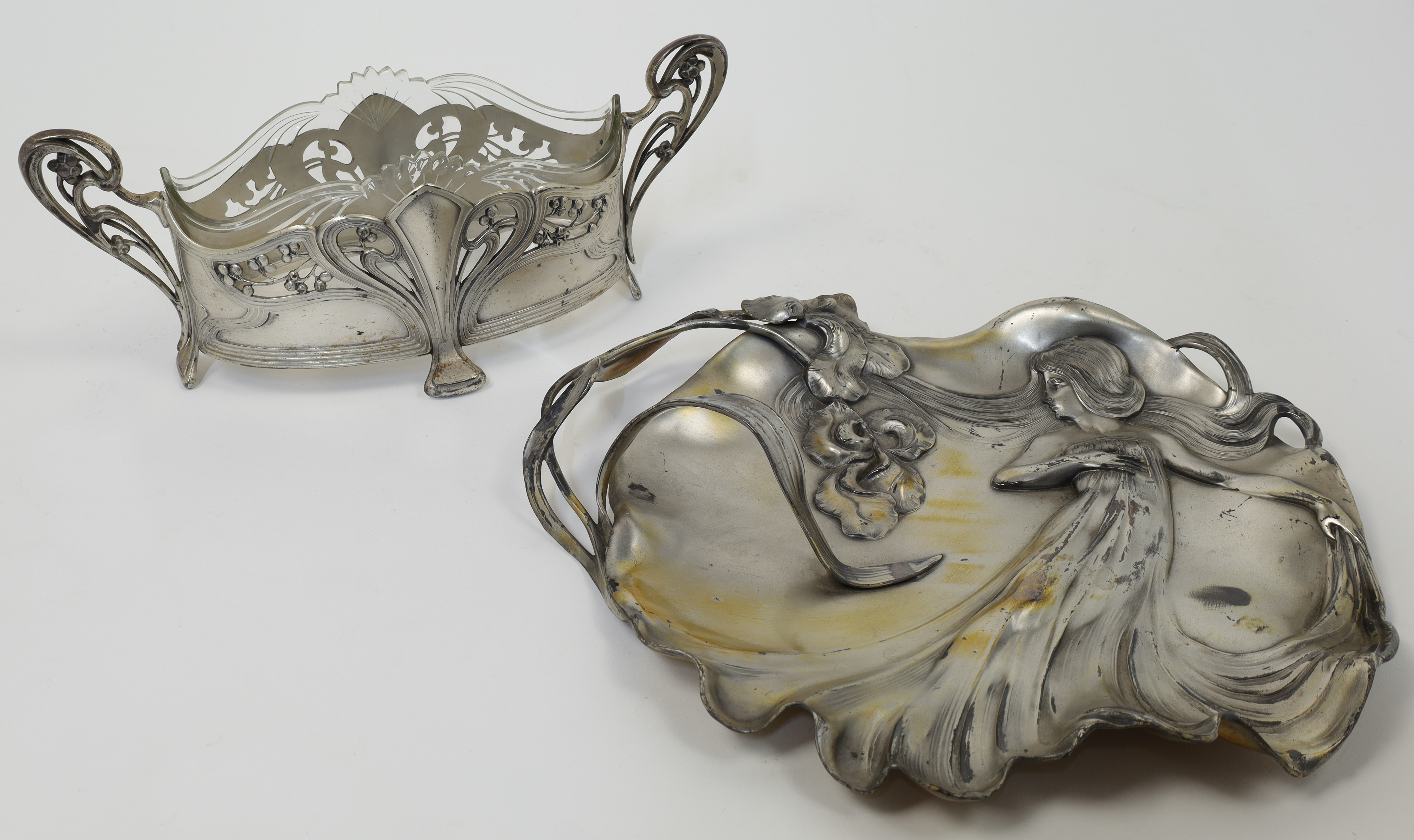 A WMF metal jardinière with glass liner, c.1930-1935, of pierced oval frame with fruiting whiplas...