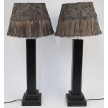 A pair of contemporary stitched black leather rectangular columnar table lamps, 21st century, on ...