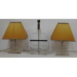 Three lucite table lamp bases, 20th century, to include a pair designed as stacking blocks at alt...