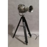 A modern chrome floor lamp, in the form of a vintage theatre spot light, marked Strand Electric, ...