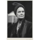 A black and white large print photograph of Dame Judi Dench (b. 1934) in character, signed to the...