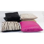 A collection of six modern cushions, comprising: five Alma cushions, including two black, one fau...