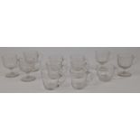 A group of five glass custard cups, 19th century, hand blown with incised helical spiral to bowls...