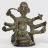 A small Indian bronze figure of a deity, 20th century, seated with eight outstretched arms, 5.6cm...