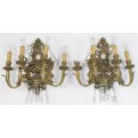 A pair of French style gilt metal four branch wall lights, late 19th century, with acanthus leaf ...