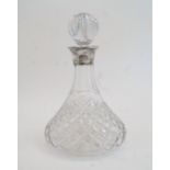 A silver mounted cut glass ships decanter and stopper, Birmingham, 1970, Charles S Green & Co. Lt...