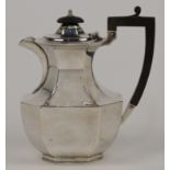 A silver hot water pot, Sheffield, 1912, Elkington & Co., makers mark rubbed, with ebonised woode...