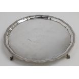 A silver salver, by Mappin & Webb, Sheffield, 1938, of circular form with scalloped and gadrooned...