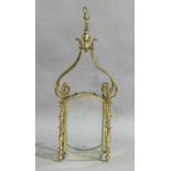 A brass framed ceiling lantern, 20th century, the four glass panels held by turned columns and sc...
