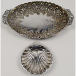 A Victorian silver dish, London, 1886, Charles Edwards, of oval form with scalloped rim and scrol...