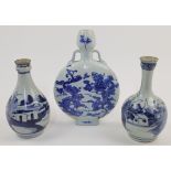 Three Chinese blue and white vases, 19th / 20th centuries, comprising: two export 'landscape' bot...