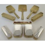 A silver-gilt dressing table set, by Mappin & Webb, London, 1943, comprising two clothes brushes,...