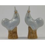 A pair of Chinese porcelain models of roosters, Republic period, in cream and brown colours with ...