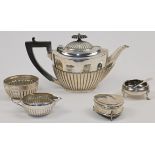 A group of silver, comprising: a Victorian teapot, Sheffield, 1898 Roberts & Belk, with gadrooned...
