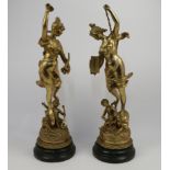 After Victor Rousseau, Belgian, 1865-1954, a pair of gilt spelter figural groups, 20th century, t...