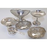 A quantity of silver items comprising: a Victorian pierced navette shaped basket, Birmingham, 186...