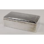 A silver cigarette box, Chester, 1917, Cohen & Charles, of rectangular form, the engine turned hi...