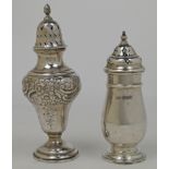 Two silver casters, comprising: one with pierced lid with flambeau finial above body with repouss...