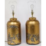 A pair of Chinese gilded tea cannister table lamps, 20th century, each decorated with scenes of b...
