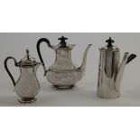 A small group of silver, comprising: a hot water pot, Sheffield, 1909, Atkin Brothers, with eboni...