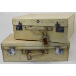 Six vellum suitcases, 20th century, of various sizes, some bearing owner's initials and travel st...