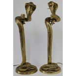 A pair of brass table lamps modelled as hissing cobras, 20th century, each with concentric circul...