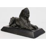 A bronze model of a recumbent sphinx, early 20th century, on rectangular base, 12.5 high