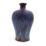 A Chinese porcelain purple flambé vase, Republic Period, of inverted baluster form with short nec...