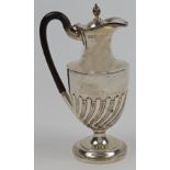 A Victorian silver ewer, London, 1899, Samuel Walton Smith, with hinged lid and wooden handle, on...