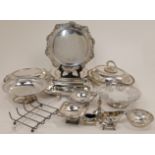 A collection of silver plated ware, to include: two serving dishes and covers, approx. 31cm wide ...