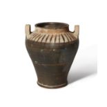 A pottery vessel with tapering body, looped handles at the shoulder, Not Ancient, 19.8cm   Prove...