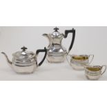 A silver matched tea and coffee service, with chased foliate band, comprising: a teapot, with ebo...