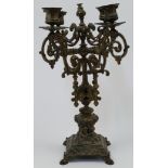 A French gilt-bronze candelabra, late 19th century, with scrolling foliate branches above four ma...