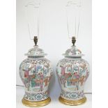 A pair of Chinese famille rose baluster vases and covers, 19th / 20th century, converted to table...