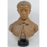 A terracotta bust of a young man, early 20th century, smartly dressed, his coat buttons inscribed...