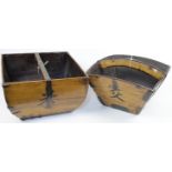 Two Chinese wood rice buckets, early 20th century, each of tapered form, with a handle across the...