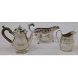 A small group of silver, comprising: a hot water pot, London, 1913, Wakely & Wheeler, with wooden...