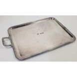 A Christofle silver plated tray, with beaded rim and scrolling handles, one detached, the handles...