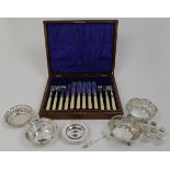 A group of silver, comprising: a near pair of pierced dishes, one Birmingham, 1950, maker's mark ...